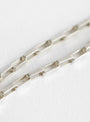 Baba Charm Necklace Clear by Lizzie Ames at Couverture & The Garbstore
Detail