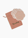 The Scalloped Coasters Set from Tomète comes in Pink at Couverture & The Garbstore
bag