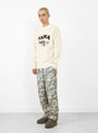 PAWA SPEED SPORTS Doggo Knit Sweater Cream at Couverture & The Garbstore
model side