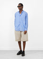 The Regular Collar Shirt comes in Blue Stripe at Couverture & The Garbstore
model front 