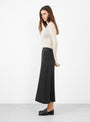 The Flat Stitch Semi Circle Knit Skirt Melange Black from Modern Weaving at Couverture & The Garbstore
model side 