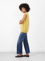 The No 455 Bos Knit Vest from Extreme Cashmere arrives in Corn at Couverture & The Garbstore
model side 