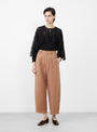 The Bari Crop Trouser from Apiece Apart comes in Deep Khaki at Couverture & The Garbstore
model 
front 