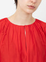 The Bonita Dress from Apiece Apart comes in Tigerlily at Couverture & The Garbstore
model detail