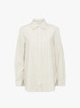 The Sodi Wrap Button Up from Apiece Apart comes in a cream and navy at Couverture & The Garbstore
front