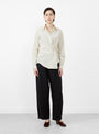 The Sodi Wrap Button Up from Apiece Apart comes in a cream and navy at Couverture & The Garbstore
model front