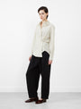 The Sodi Wrap Button Up from Apiece Apart comes in a cream and navy at Couverture & The Garbstore
model side 