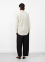 The Sodi Wrap Button Up from Apiece Apart comes in a cream and navy at Couverture & The Garbstore
model back