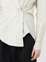 The Sodi Wrap Button Up from Apiece Apart comes in a cream and navy at Couverture & The Garbstore
model button