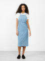 The Yumi Apron Dress from Baserange comes in Light Wash Blue at Couverture & The Garbstore
model front