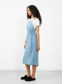 The Yumi Apron Dress from Baserange comes in Light Wash Blue at Couverture & The Garbstore
model side