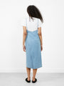 The Yumi Apron Dress from Baserange comes in Light Wash Blue at Couverture & The Garbstore
model back 