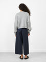 The Angum Knit from Bellerose comes in Heather Grey at Couverture & The Garbstore
model side