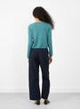 The Fitted Crop V-Neck Jumper from Himalayan Cashmere comes in Myrtle at Couverture & The Garbstore
model back 