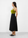 The No 470 Seduce Knit Skirt comes in Raven from Extreme Cashmere at Couverture & The Garbstore
model side