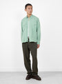 The Tencel Pearlsnap Shirt from Wythe comes in Sage at Couverture & The Garbstore
model front