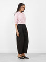 The Spa Pleat Trousers come in Black from Apiece Apart at Couverture & The Garbstore model side