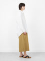 The Signature Cocoon Dress Shirt comes in Off White from 7115 by Szeki at Couverture & The Garbstore
model side