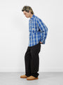 The Lau Plaid Shirt Jacket from Stüssy comes in Blue at Couverture & The Garbstore
model side