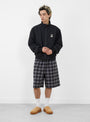 The Plaid Beach Short from Stüssy comes in Black at Couverture & The Garbstore 
model front