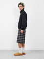 The Plaid Beach Short from Stüssy comes in Black at Couverture & The Garbstore 
model side
