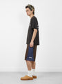 The Curved Panel Board Short from Stüssy comes in Brown at couverture & The Garbstore
model side