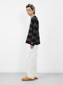 The Striped Wool Sweater from Stüssy comes in Black at Couverture & The Garbstore 
model side
