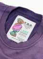 The American Waste T-Shirt from TDR comes in Purple at Couverture & The Garbstore
label