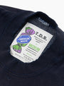 The American Waste Sweatshirt from TDR comes in Navy at Couverture & The Garbstore
label