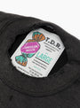 The American Waste Sweatshirt from TDR comes in Black at Couverture & The Garbstore
label