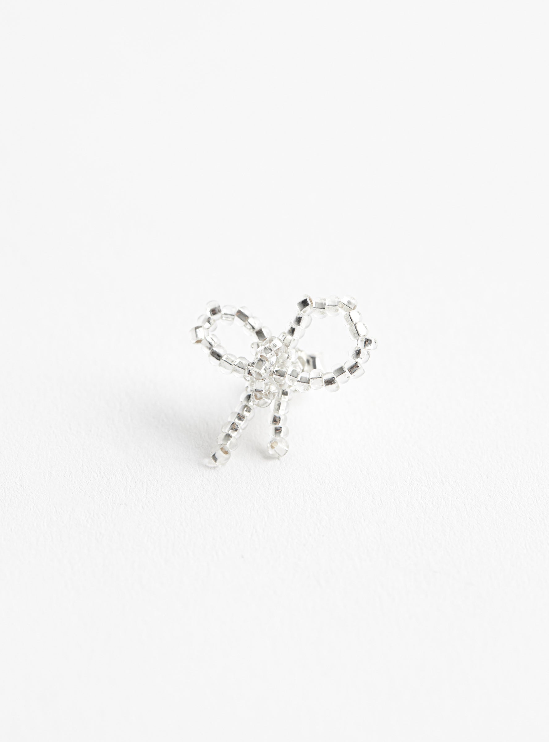 Mini Bow Ear Stick SilverSilverPura Utz (front view) at Couverture & The Garbstore