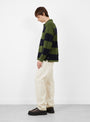 Pique Knit Stripe Rugby Shirt Olive Stussy (modle side) at Couverture & The Garbstore